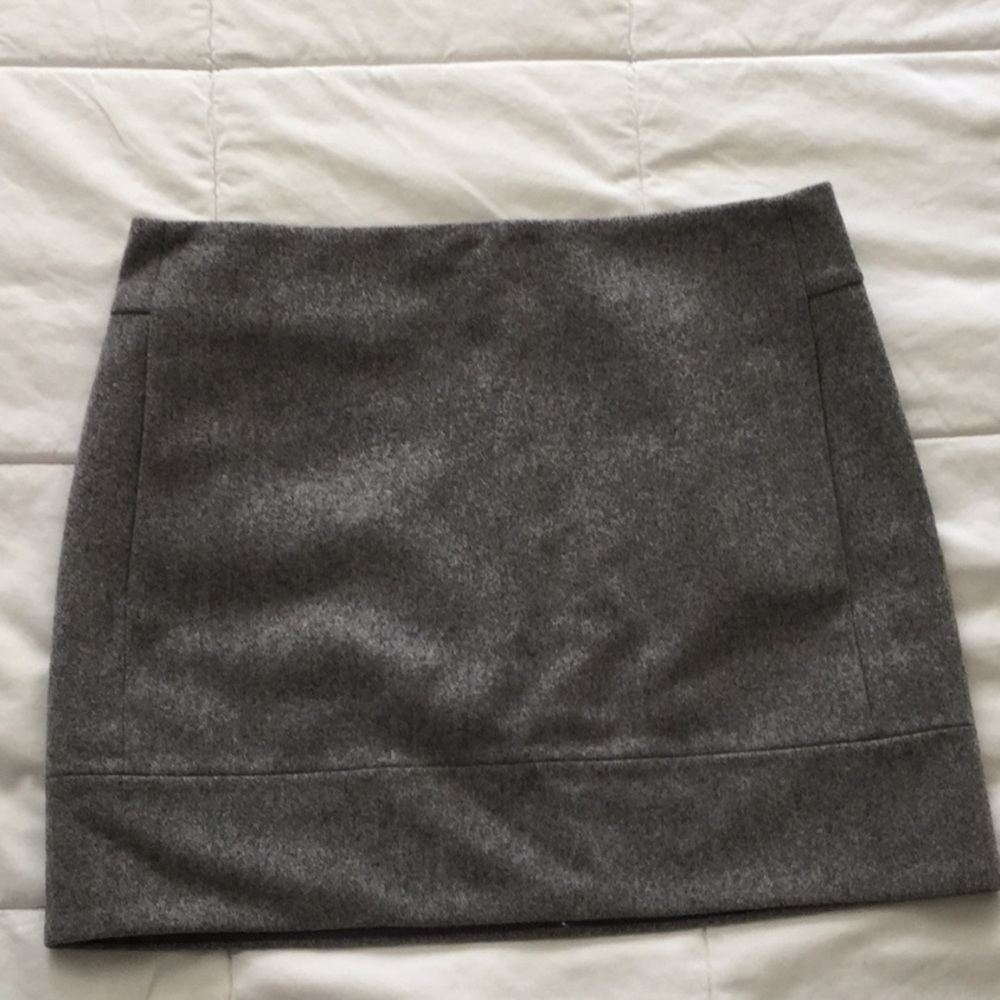 Gray, lined wool, skirt with side pockets.